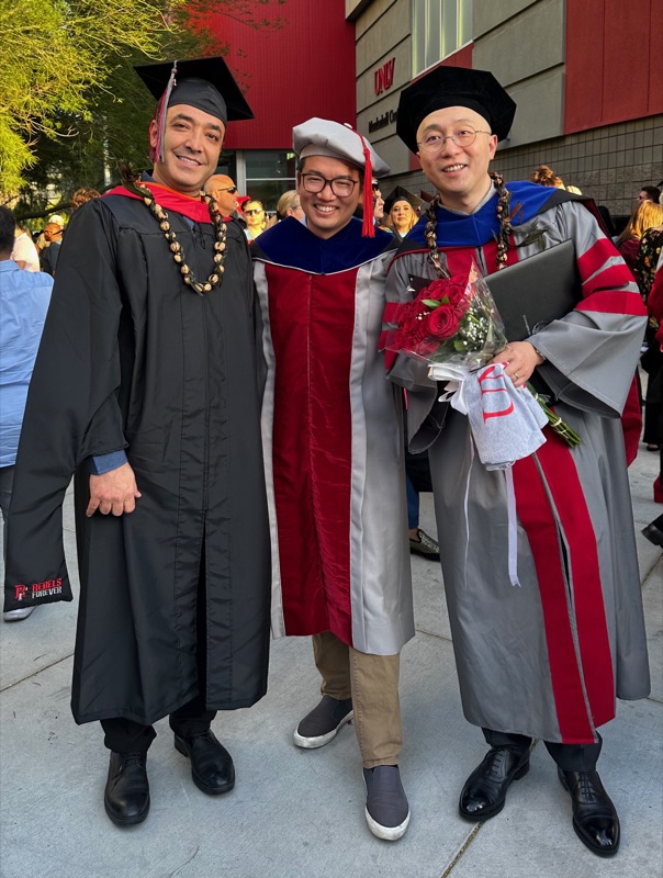 Yiwei Gao and Amir Kashani in graduation regalia